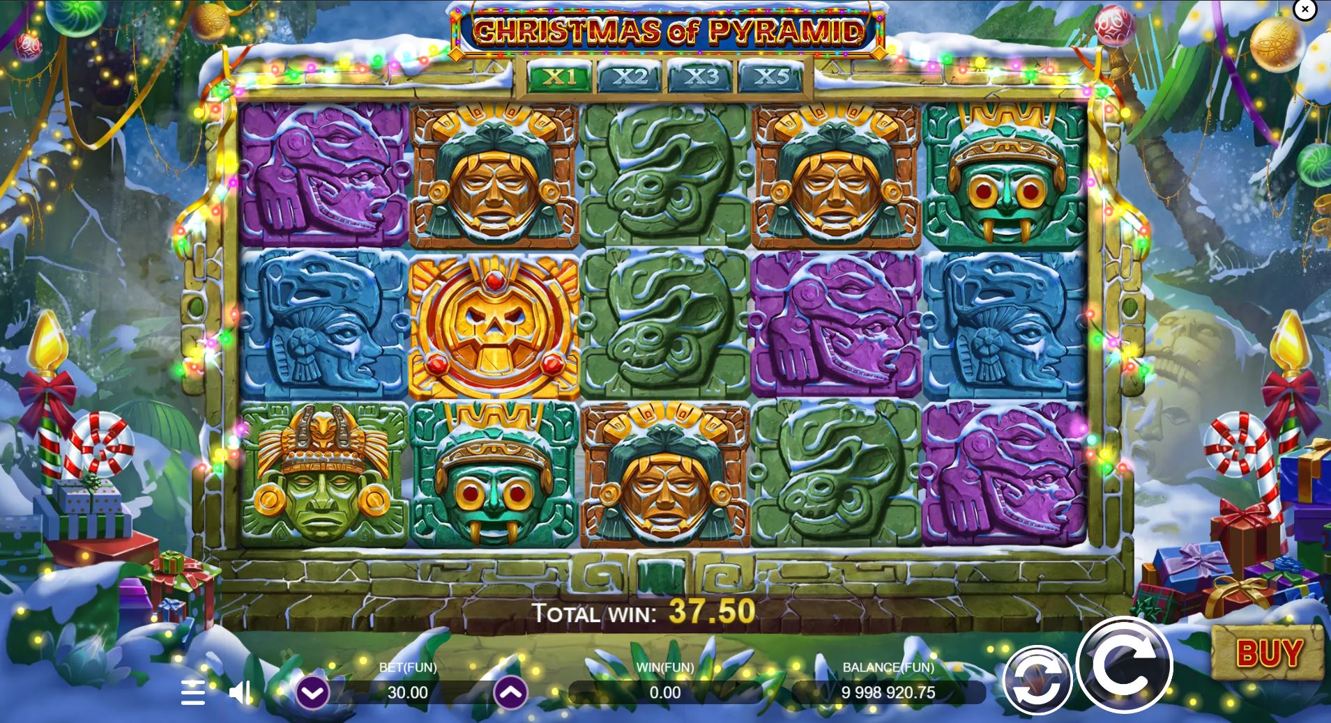 The main 5x3 game grid of the Christmas of Pyramid slot, showcasing the snowy Aztec theme and multiplier meter.