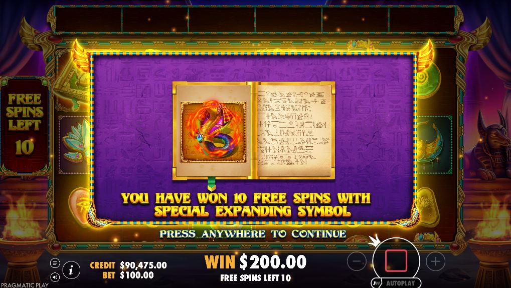 The game screen showing the randomly chosen special expanding symbol before the Book of Golden Sands free spins begin.