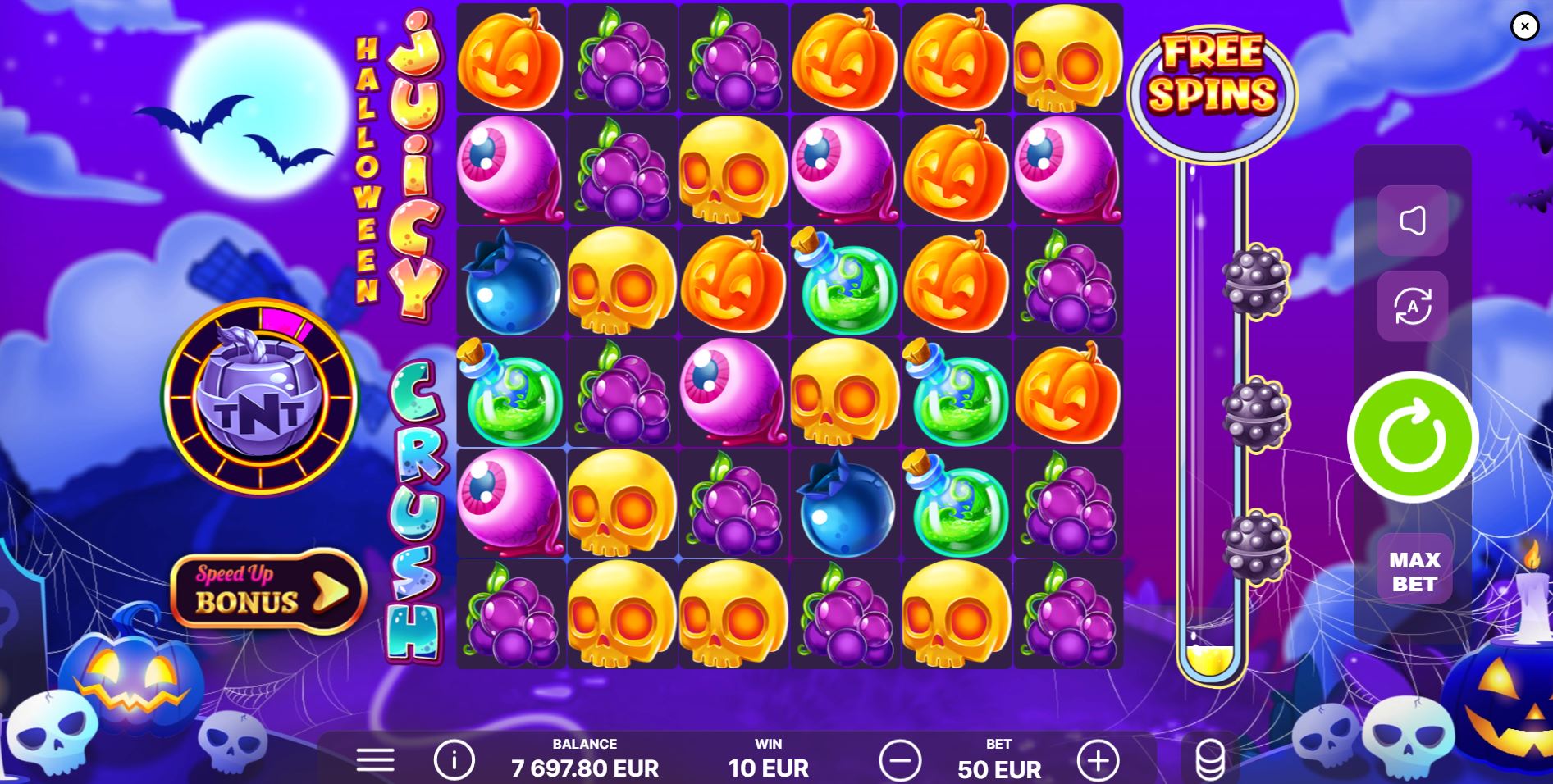 The 6x6 grid of the Juicy Crush Halloween slot, displaying colorful spooky symbols against a moonlit backdrop.