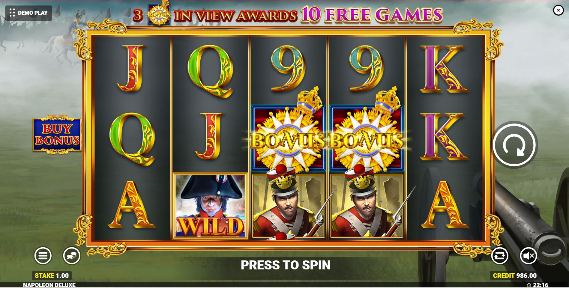 The base game grid of the Napoleon Deluxe slot, showing historical symbols against a battlefield backdrop.