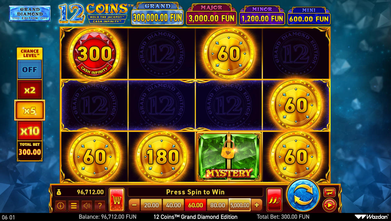 The 4x3 grid of the 12 Coins Grand Diamond Edition slot in the base game, showing various bonus symbols and empty spaces, illustrating the 'bonus-only' payout system.