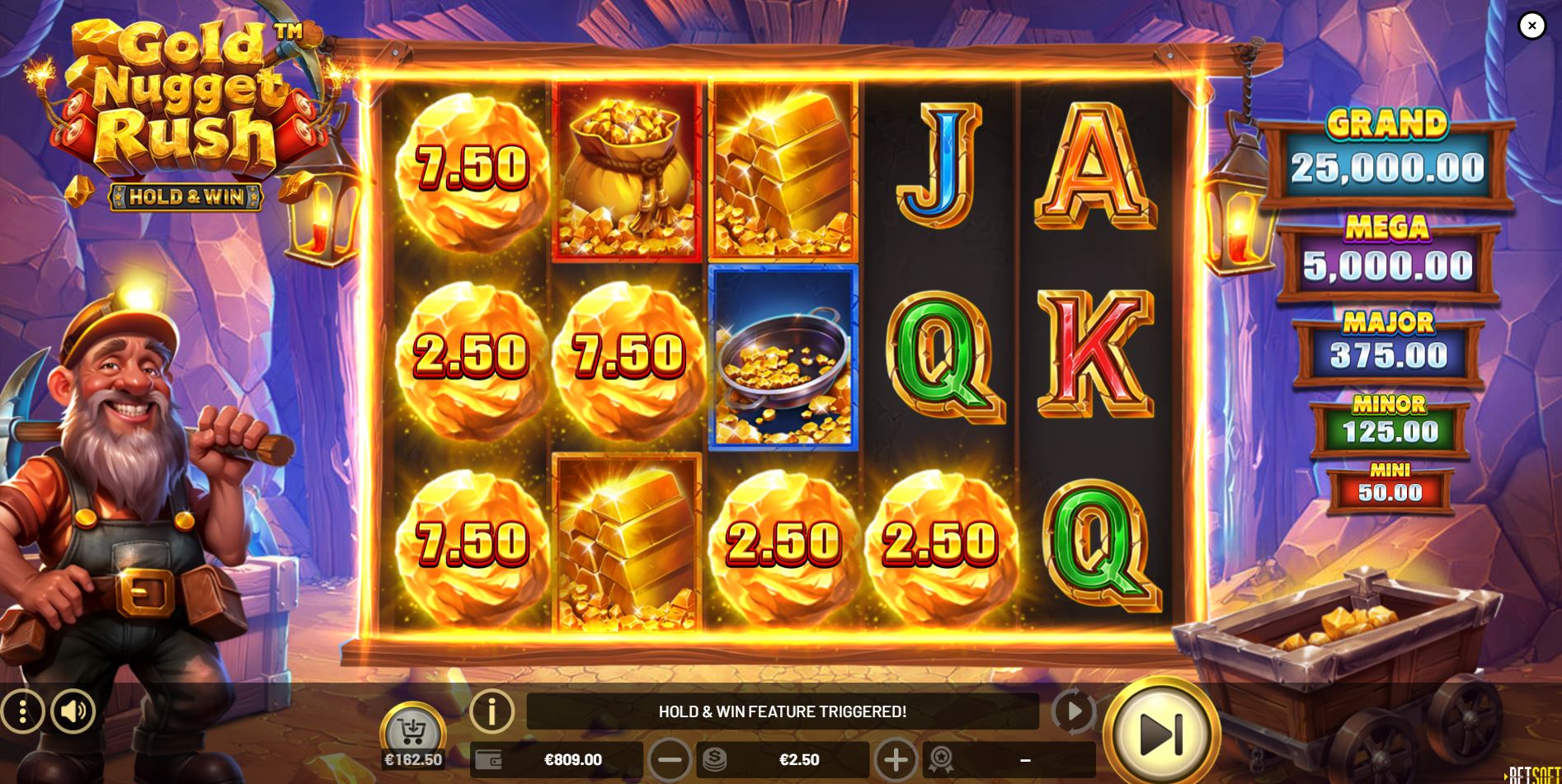 The Hold & Win feature begins in Gold Nugget Rush, with six golden nugget bonus symbols locked in place.