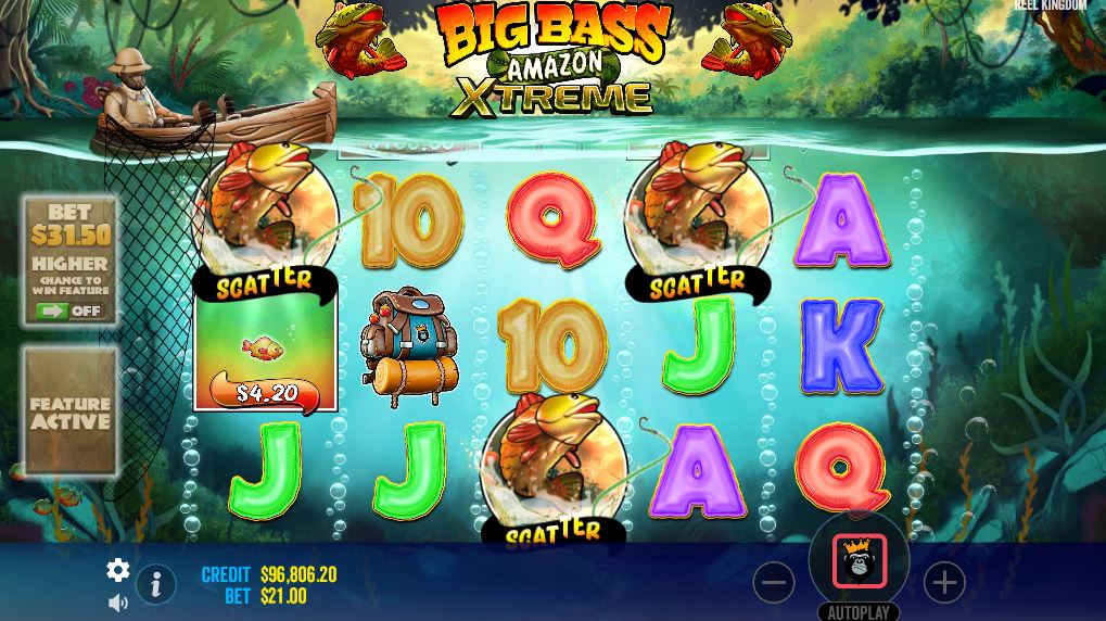 Three Fish Scatter symbols landing on the reels to trigger the Free Spins bonus in Big Bass Amazon Xtreme.