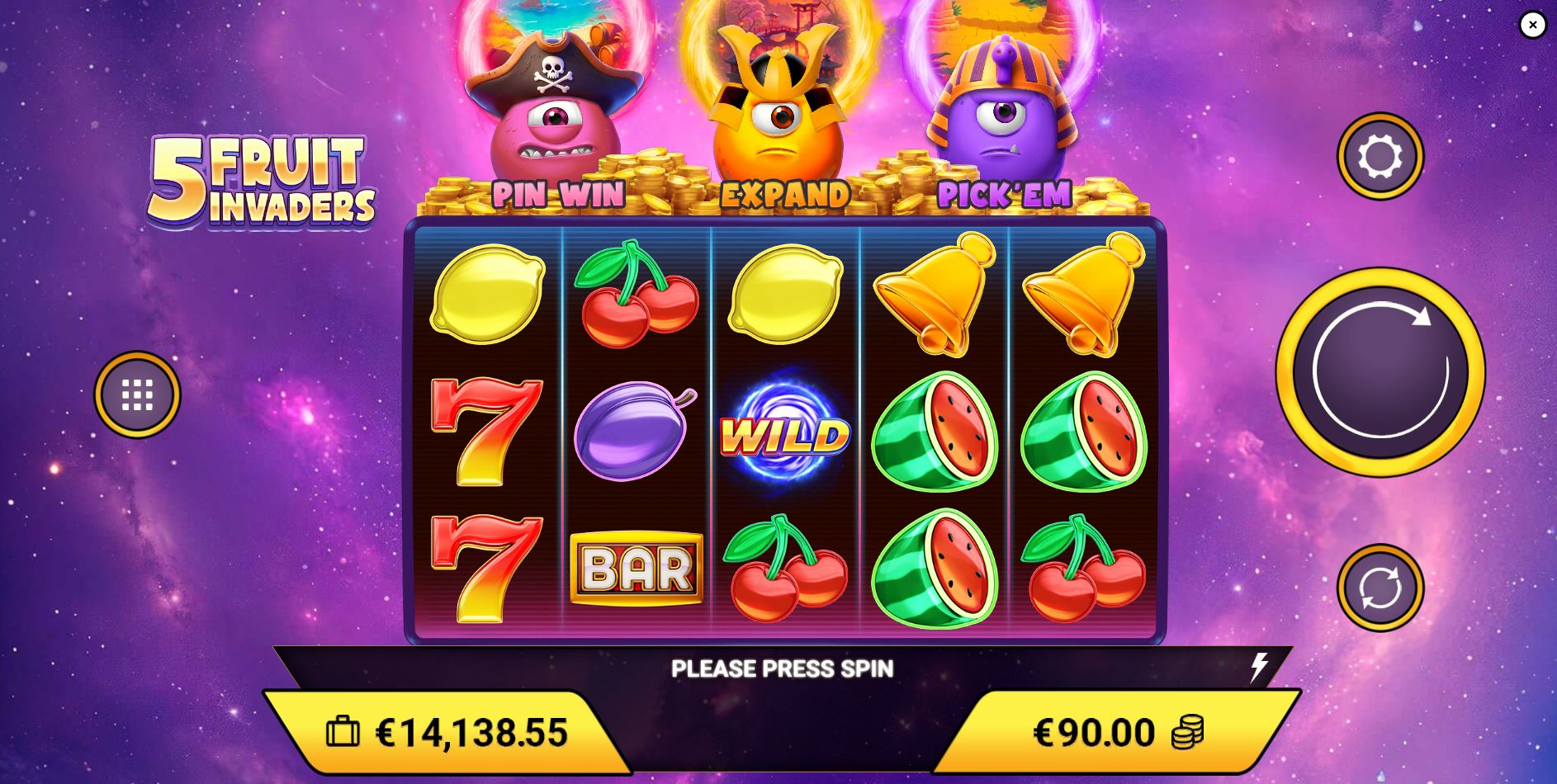 The base game grid of the 5 Fruit Invaders slot, showing the fruit symbols and three active monster collectors above the reels.