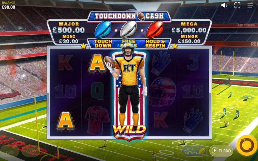 The Touchdown Cash slot game featuring an expanded wild symbol of a football player on the center reel and four jackpots displayed above.