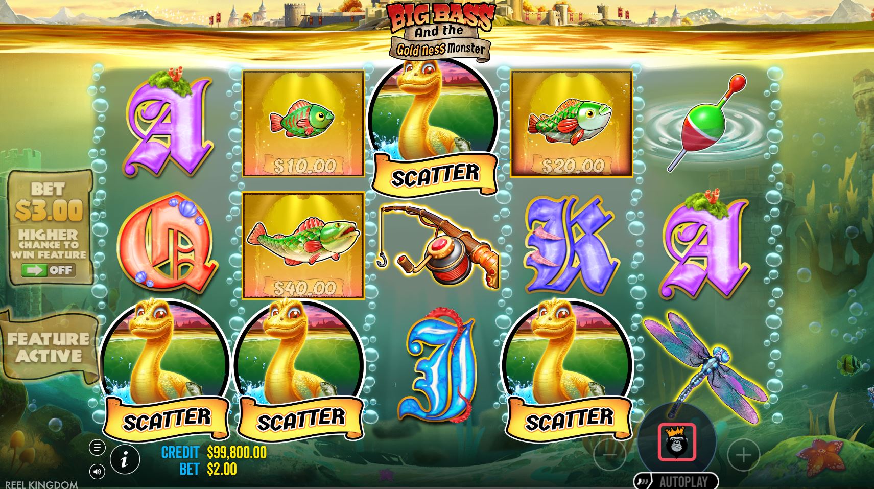 Three Gold Ness Monster scatter symbols landing on the reels to trigger the free spins feature in the Big Bass slot.