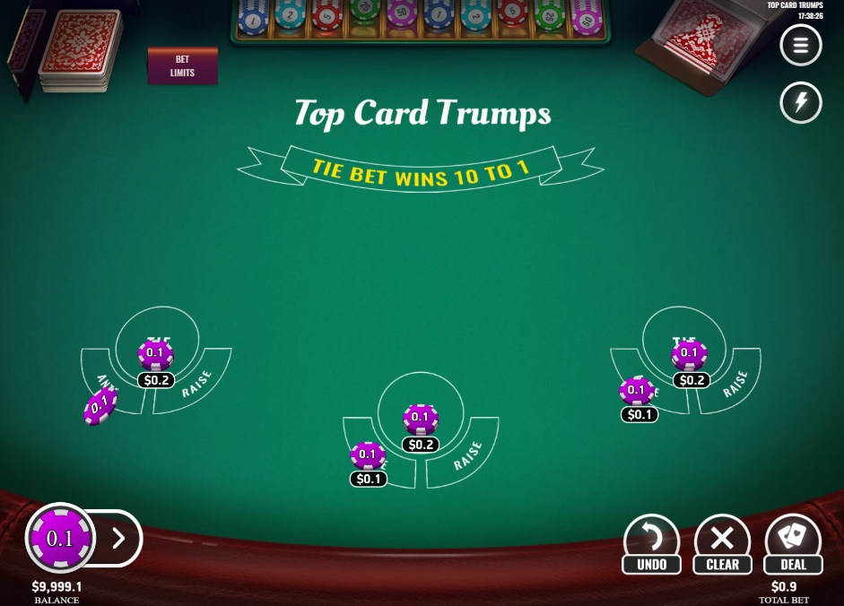 The main game table of Top Card Trumps by Platipus, showing the three betting hands on the green felt.