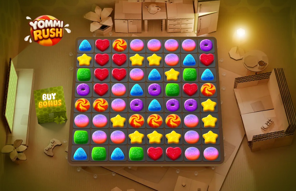 The main screen of the Yommi Rush slot demo, showing the 8x8 grid with various candy symbols and the whimsical cardboard background.