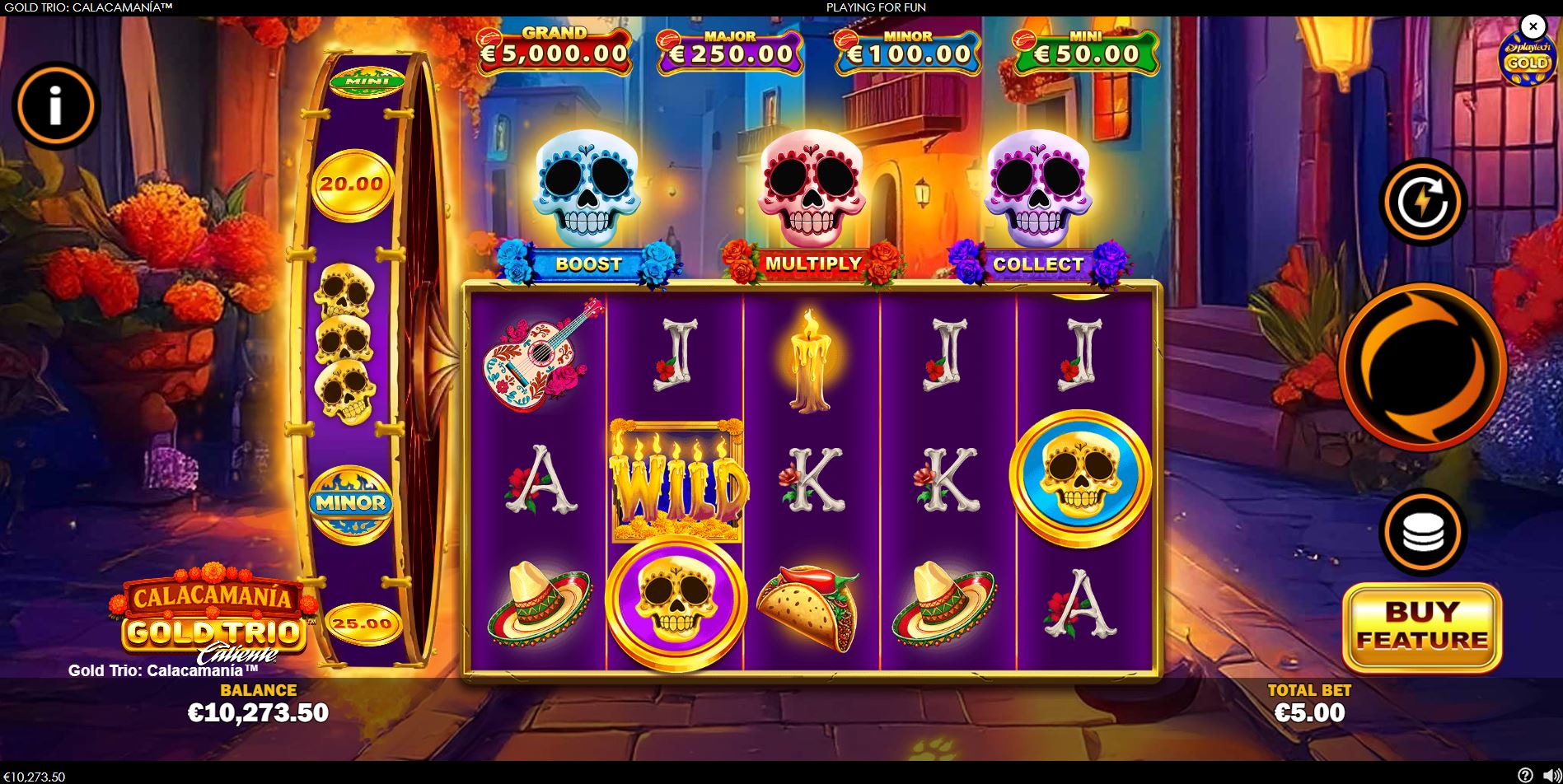 The main 5x3 game grid of the Gold Trio: Calacamania slot, displaying the Mexican street theme and jackpot values.