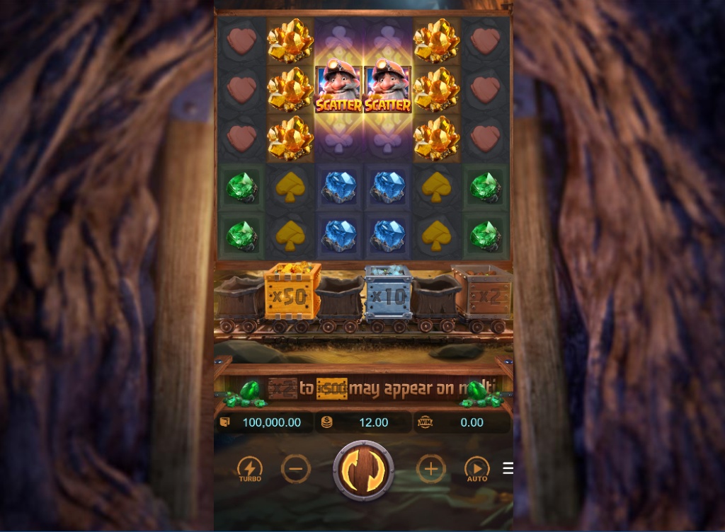 Gemstones Gold slot base game interface showing 6x5 grid and multiplier reel with blockers.