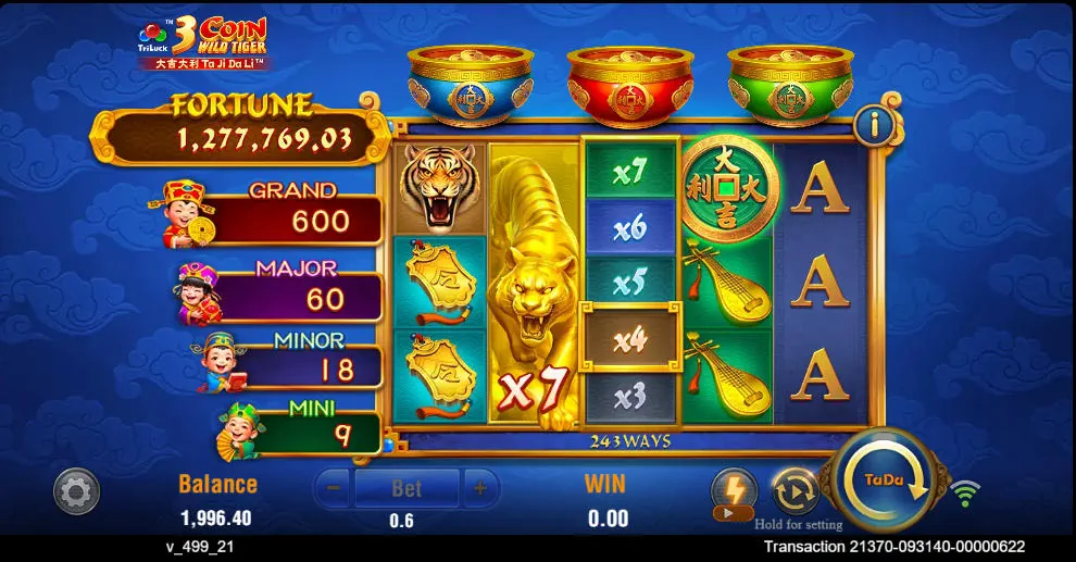 Expanding Golden Tiger symbol on the center reel of 3 Coin Wild Tiger slot with a 7x multiplier active.