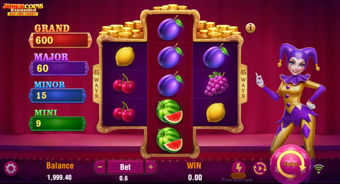 The main game screen of Joker Coins Expanded slot, showcasing the 3-5-3 reel layout and the central Joker Coin symbol on reel 2, indicating the start of a spin.
