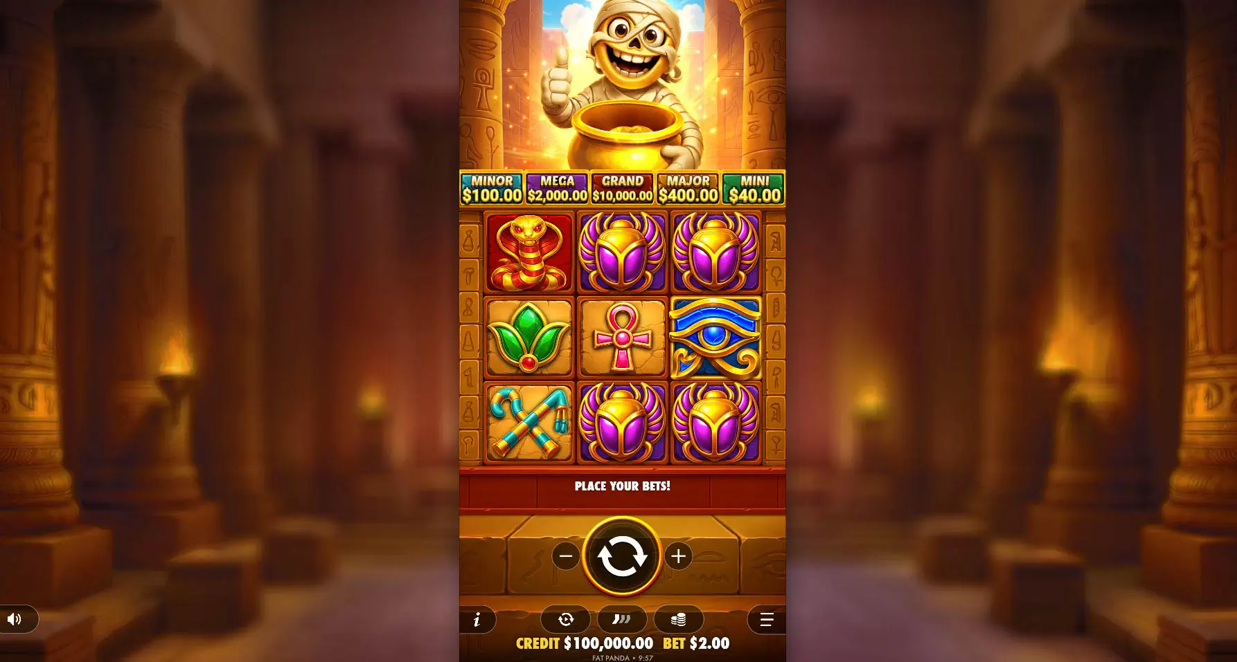 The 3x3 reel layout of Tut's Treasure Tower base game, showing the cartoon mummy mascot and Egyptian symbols, illustrating the starting gameplay grid.