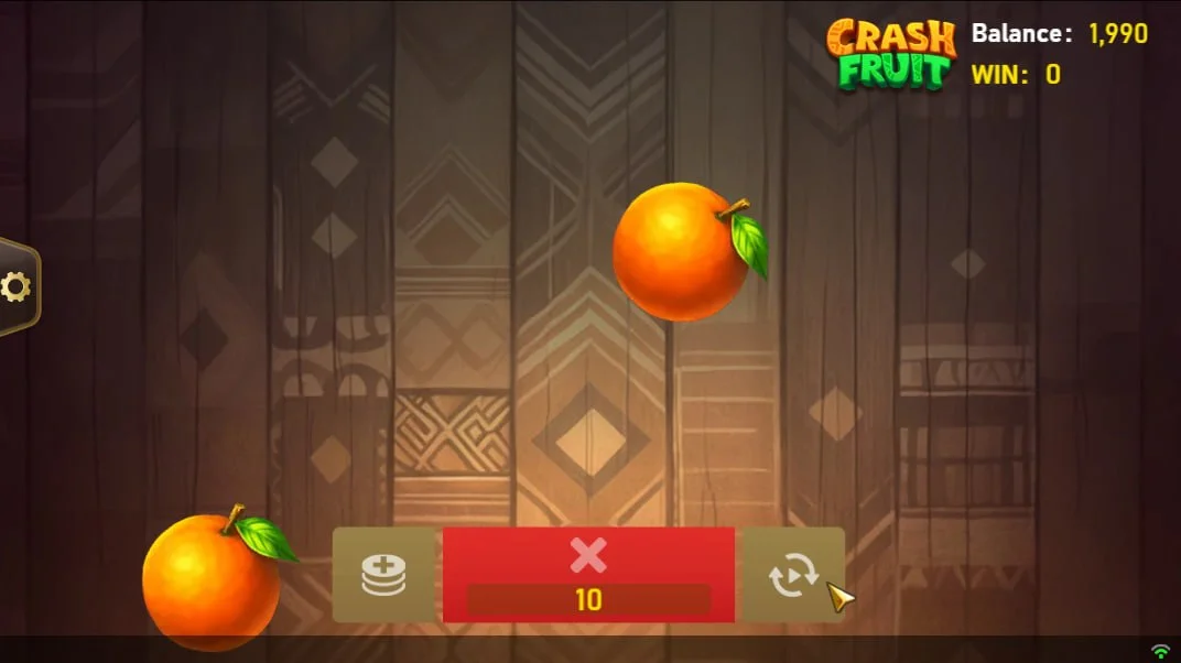 Slicing oranges in the Crash Fruit base game to reveal multipliers against a tribal background for high-stakes rewards.
