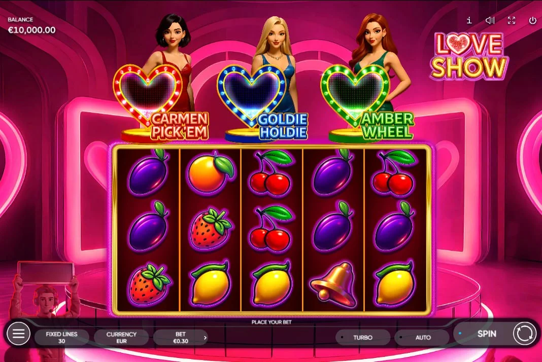 Full view of Love Show slot reels with three hostesses Carmen, Goldie, and Amber, showing the main game environment for players to see the character layout.